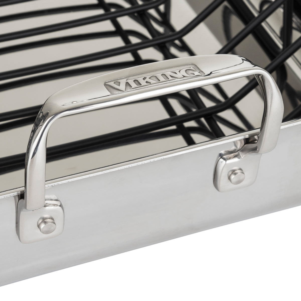 Close-up of the Viking Culinary Products 3-Ply Stainless Steel Roaster with metal handles, a removable nonstick rack inside, and includes a bonus digital thermometer.