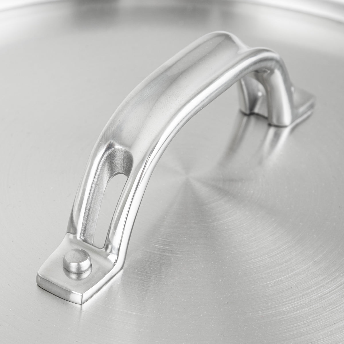 Close-up view of a Viking Culinary Products Stainless Steel Lid - Fits 24cm Interior Diameter Pan, featuring a metal lid with a riveted, arched handle.
