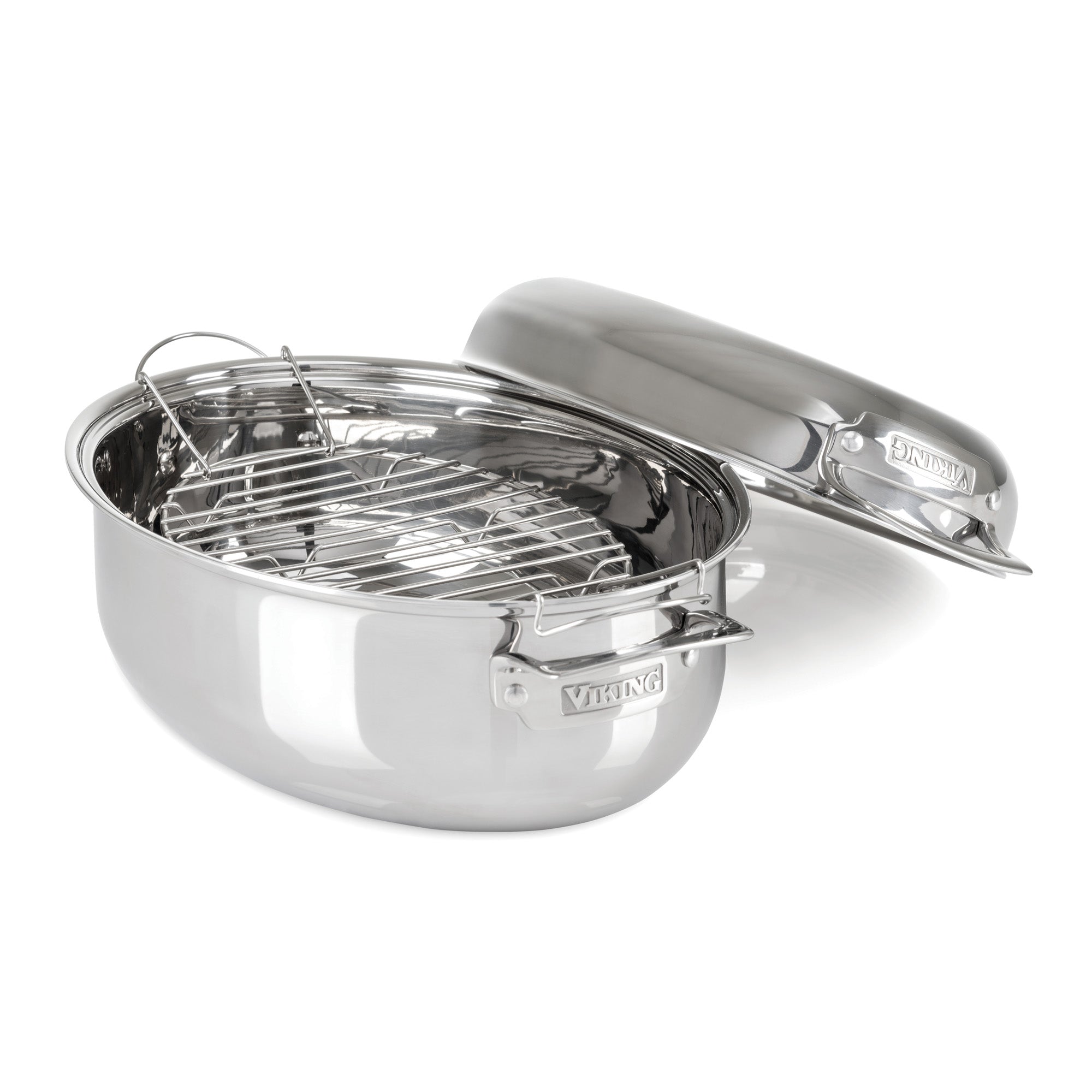 The Viking Culinary Products 3-Ply 8.5-Quart 3-in-1 Oval Roaster features handles, an elevated rack, a matching domed lid, and is induction compatible for versatile kitchen use.
