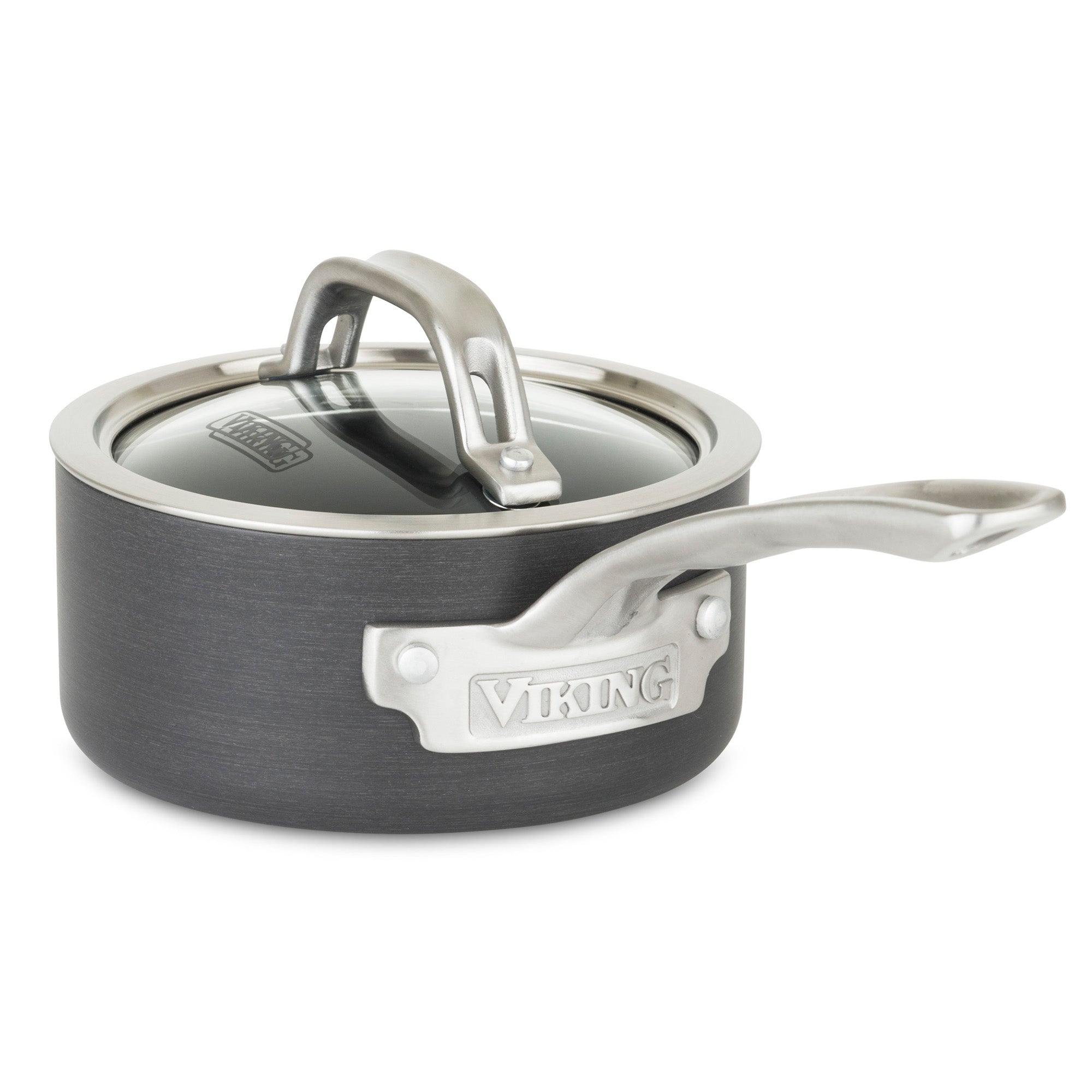 The Viking Hard Anodized Nonstick 1-Quart Sauce Pan with Glass Lid from Viking Culinary Products has a gray anodized aluminum body, stay-cool stainless steel handle, glass lid, and a metal Viking logo plate on the side.