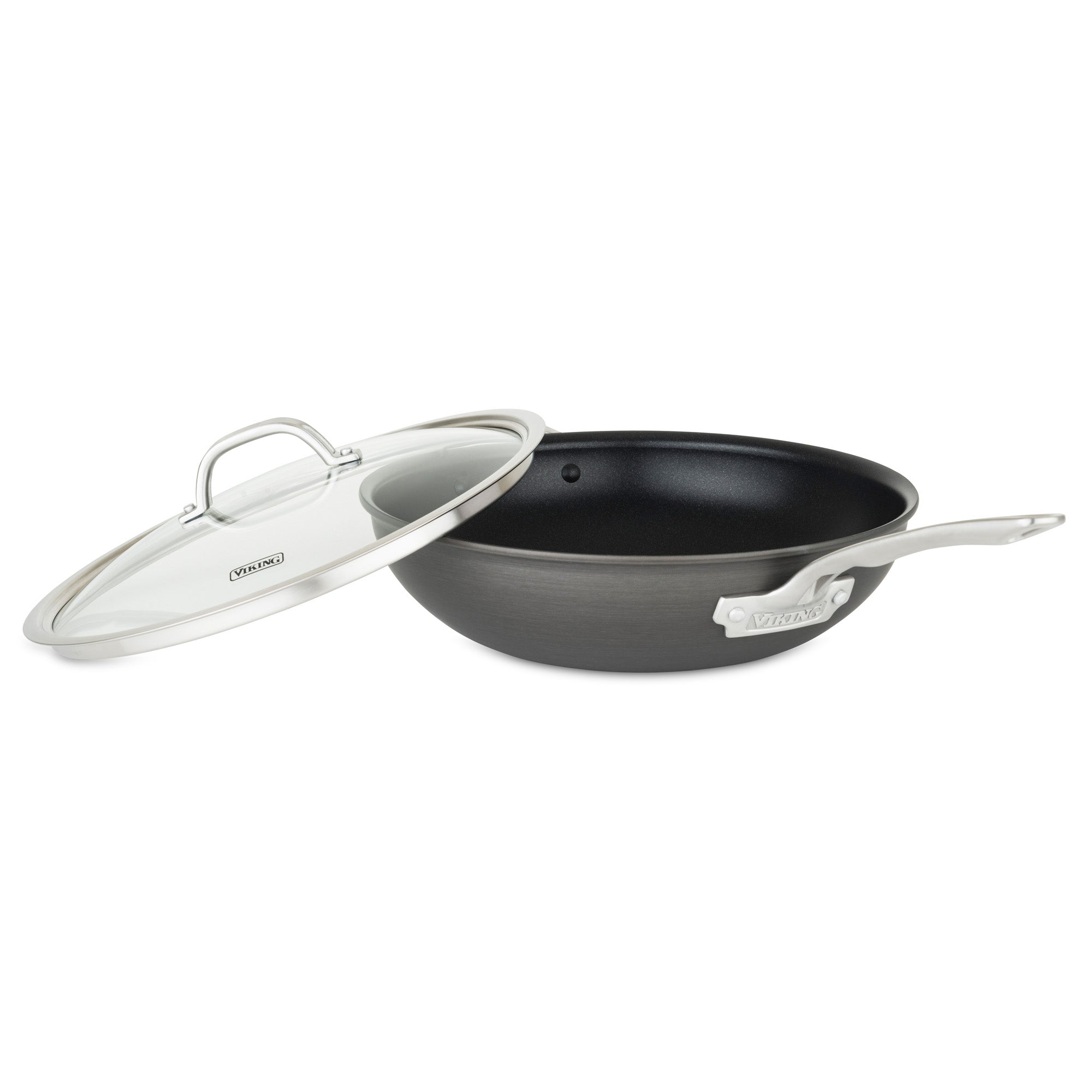 A Viking Culinary Products Hard Anodized Nonstick 12-Inch Covered Chefs Pan with a glass lid rests partially open beside it, both set against a plain white background.