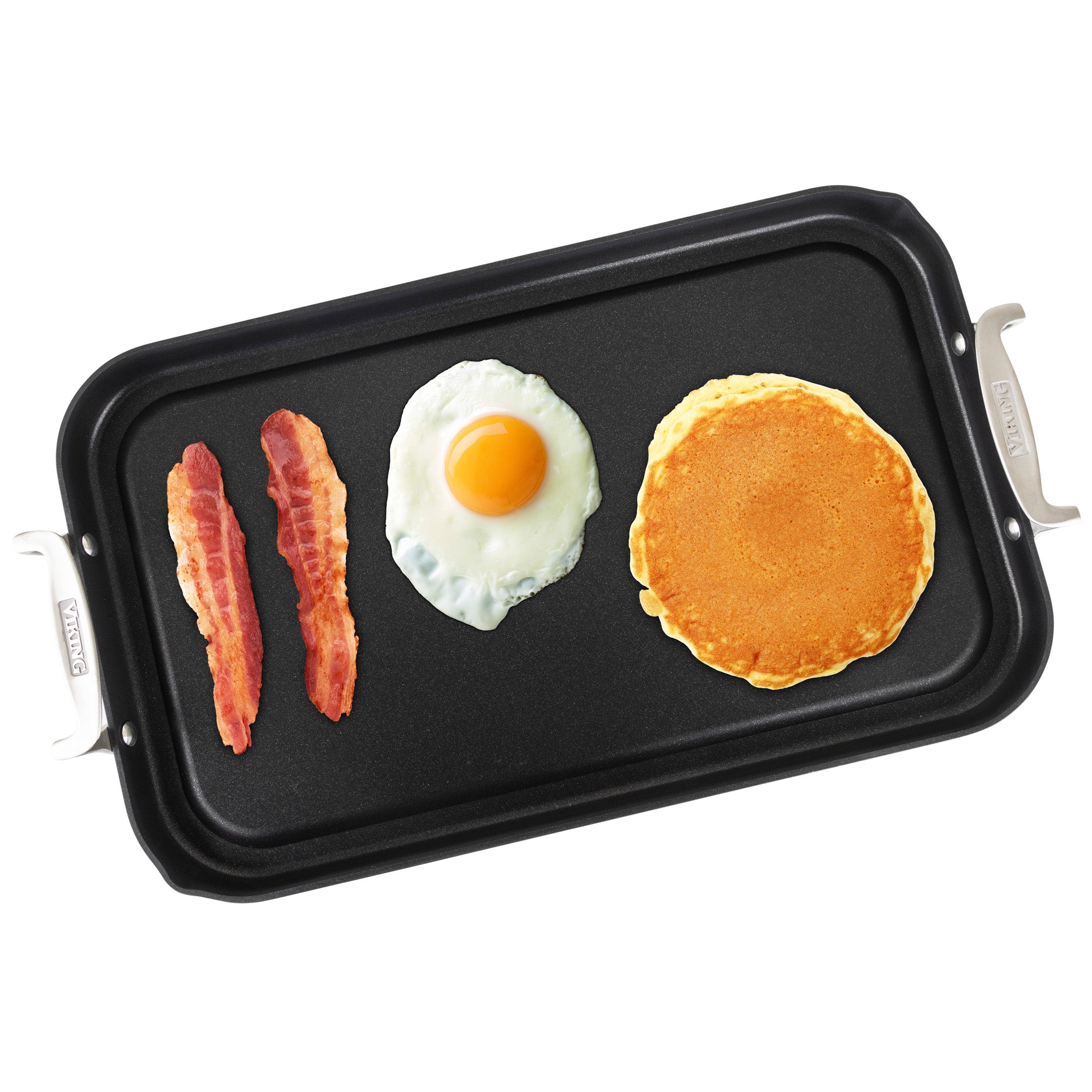 The Viking Hard Anodized Nonstick Double Burner Griddle by Viking Culinary Products displays, from left to right, two strips of cooked bacon, a sunny-side-up egg, and a golden pancake.