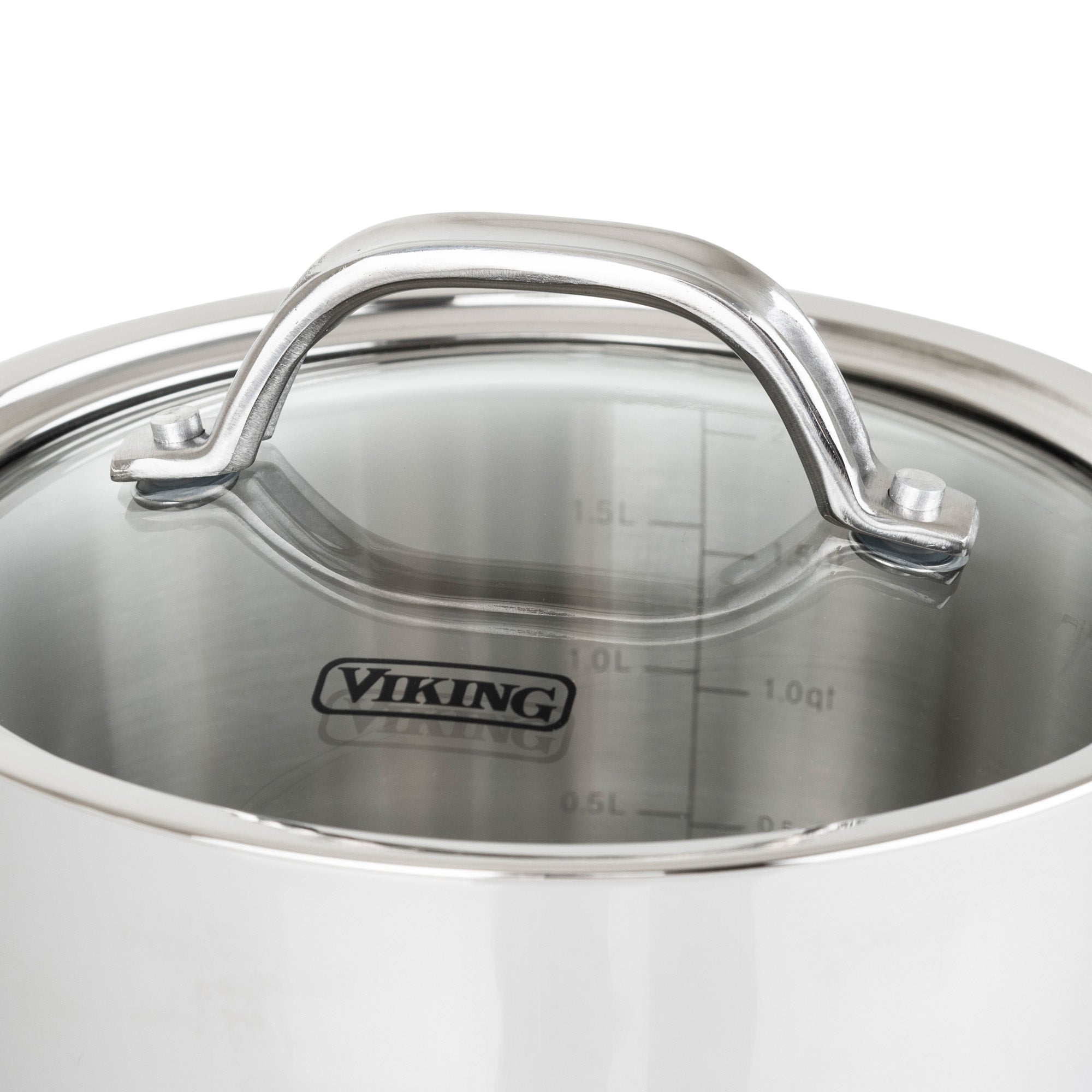 A close-up of the Viking Contemporary 3-Ply 2.4-Quart Sauce Pan by Viking Culinary Products, featuring a glass lid with the brand name, metal handle, measurement markings inside, and induction compatibility.