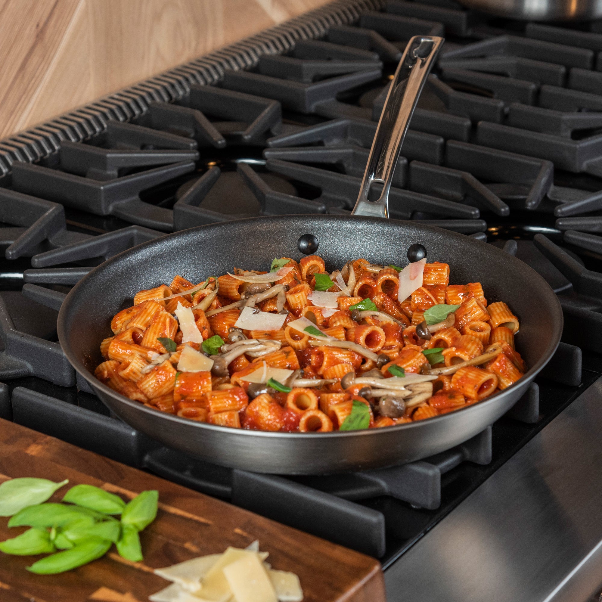 A Viking Culinary Products Professional 5-Ply 12-Inch Nonstick Fry Pan with Stay-Cool Handles and durable 5-ply construction ensures even heating while you cook pasta on the stove.