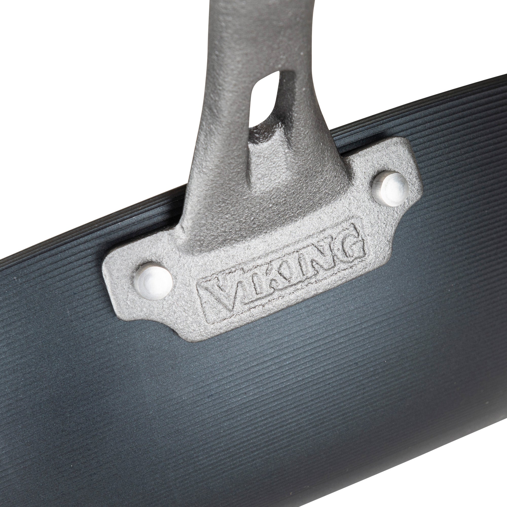 Close-up of a metal handle on the Viking Culinary Products Blue Carbon Steel 12-Inch Wok, with VIKING embossed on the bracket. The textured grip handle has two screw holes and is attached to the dark pre-seasoned carbon steel pan.