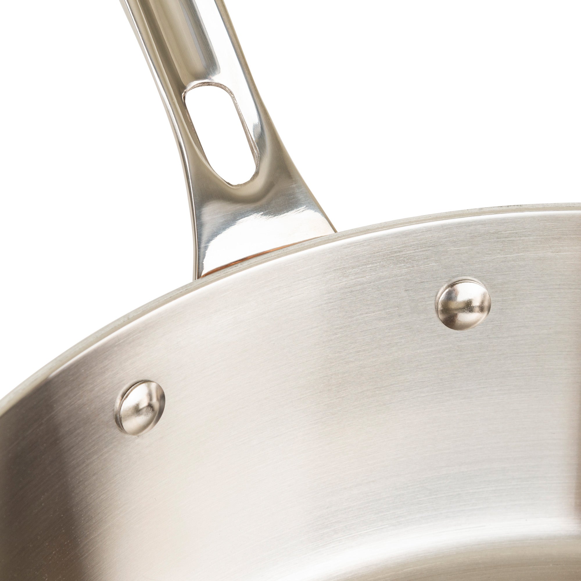 Close-up of the Viking Contemporary 4-Ply Copper Clad 9-Piece Cookware Set by Viking Culinary Products, showcasing a stainless steel pan with a stay-cool handle attached by two rivets, set against a plain background.