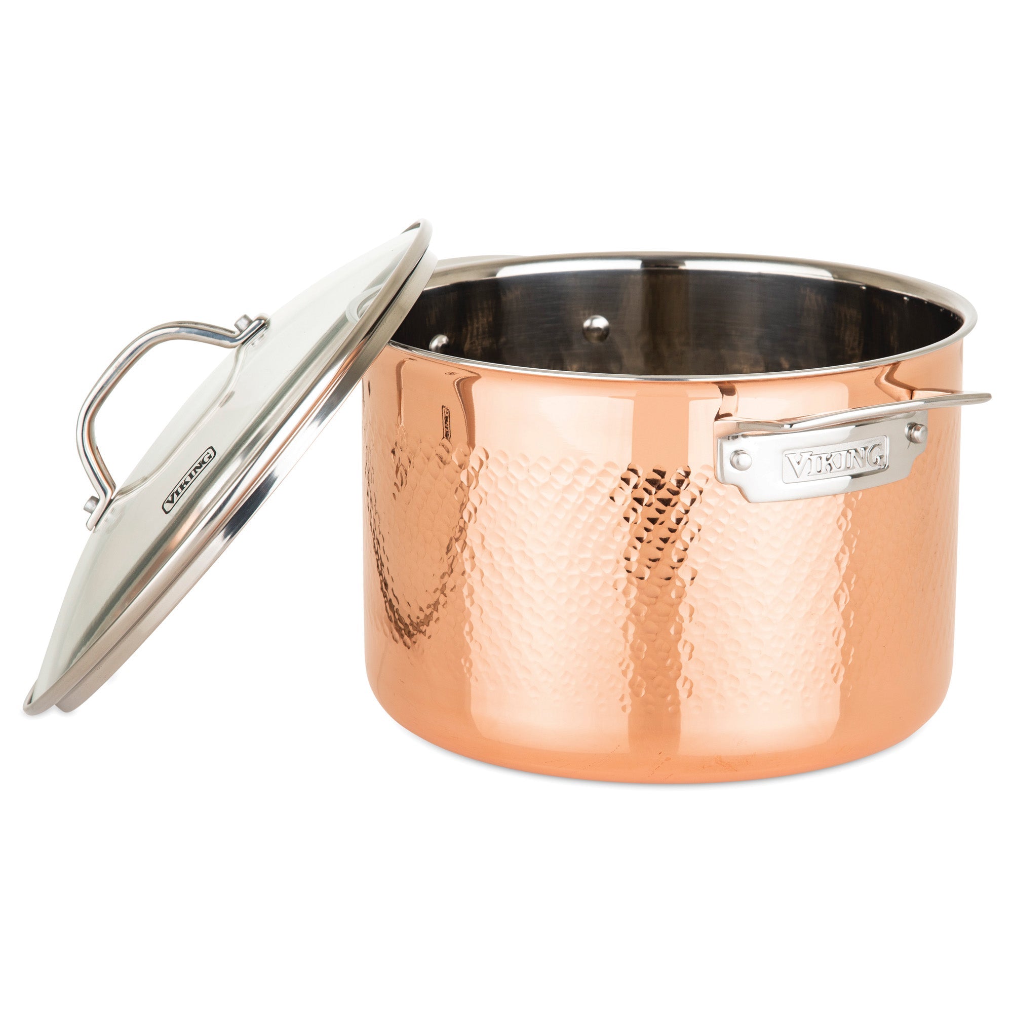 A Viking Culinary Products 3-Ply Hammered Copper Clad pot with stainless steel interior and metal handle sits beside its matching glass lid, elegantly branded VIKING on the side. Part of a 10-piece cookware set.