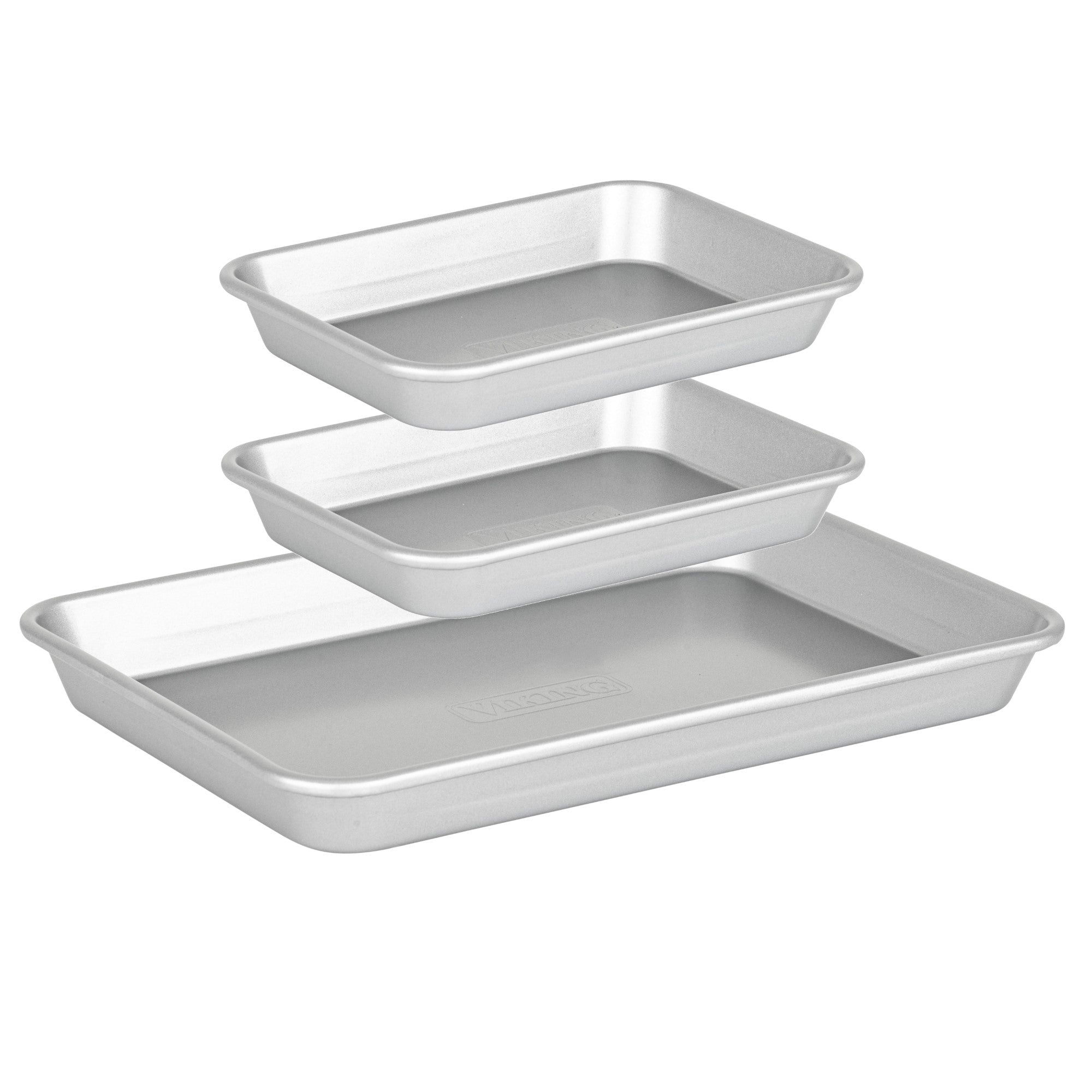 The Viking Culinary Products Aluminized Steel Nonstick 3-pc Nesting Baking Sheet Set features three silver rectangular pans of different sizes with rounded corners, smooth edges, and stackable design.