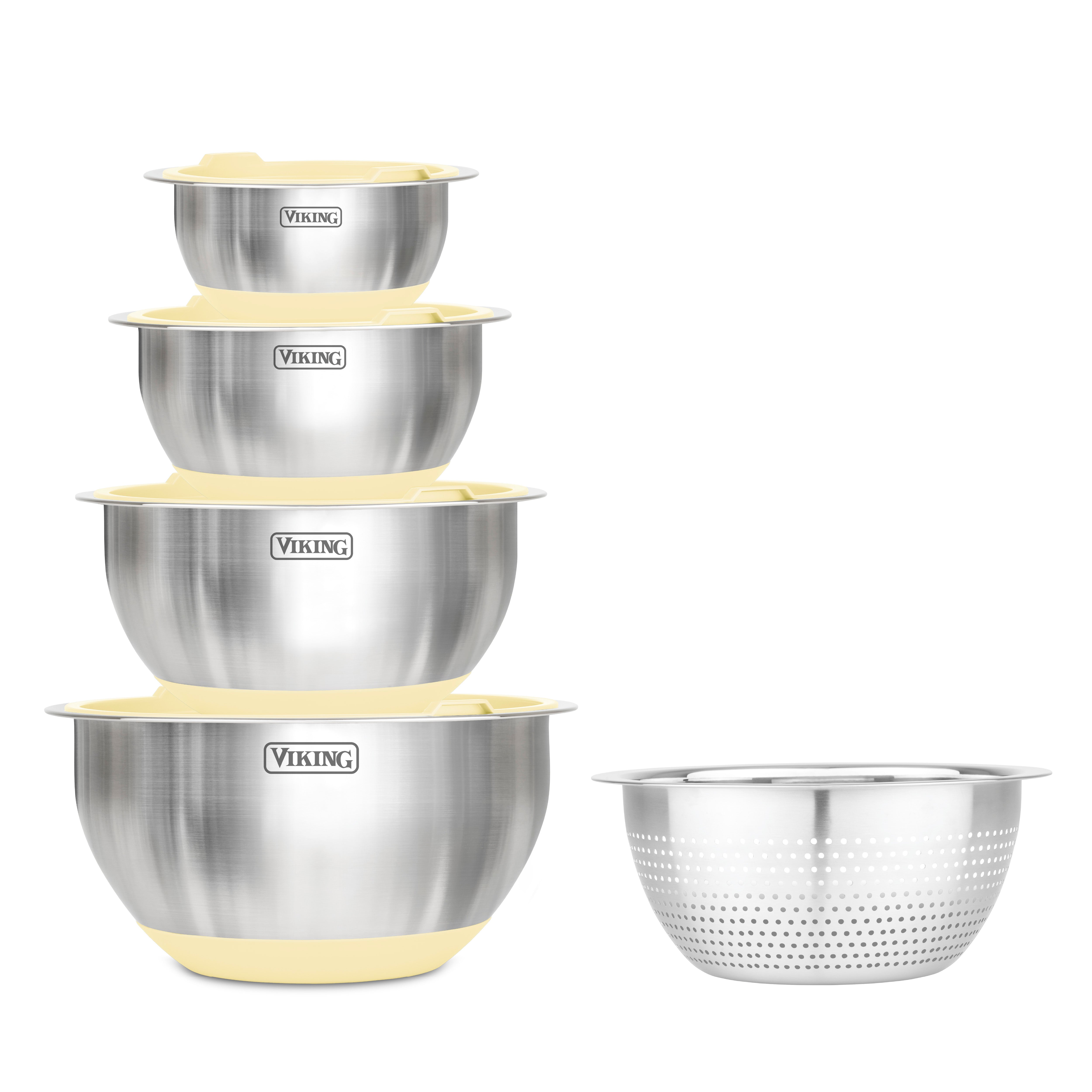 The Viking 9-Piece Stainless Steel Mixing Bowl Set with Strainer in Buttermilk by Viking Culinary Products features four nesting bowls with yellow silicone bases and a matching colander, all displaying the Viking logo.