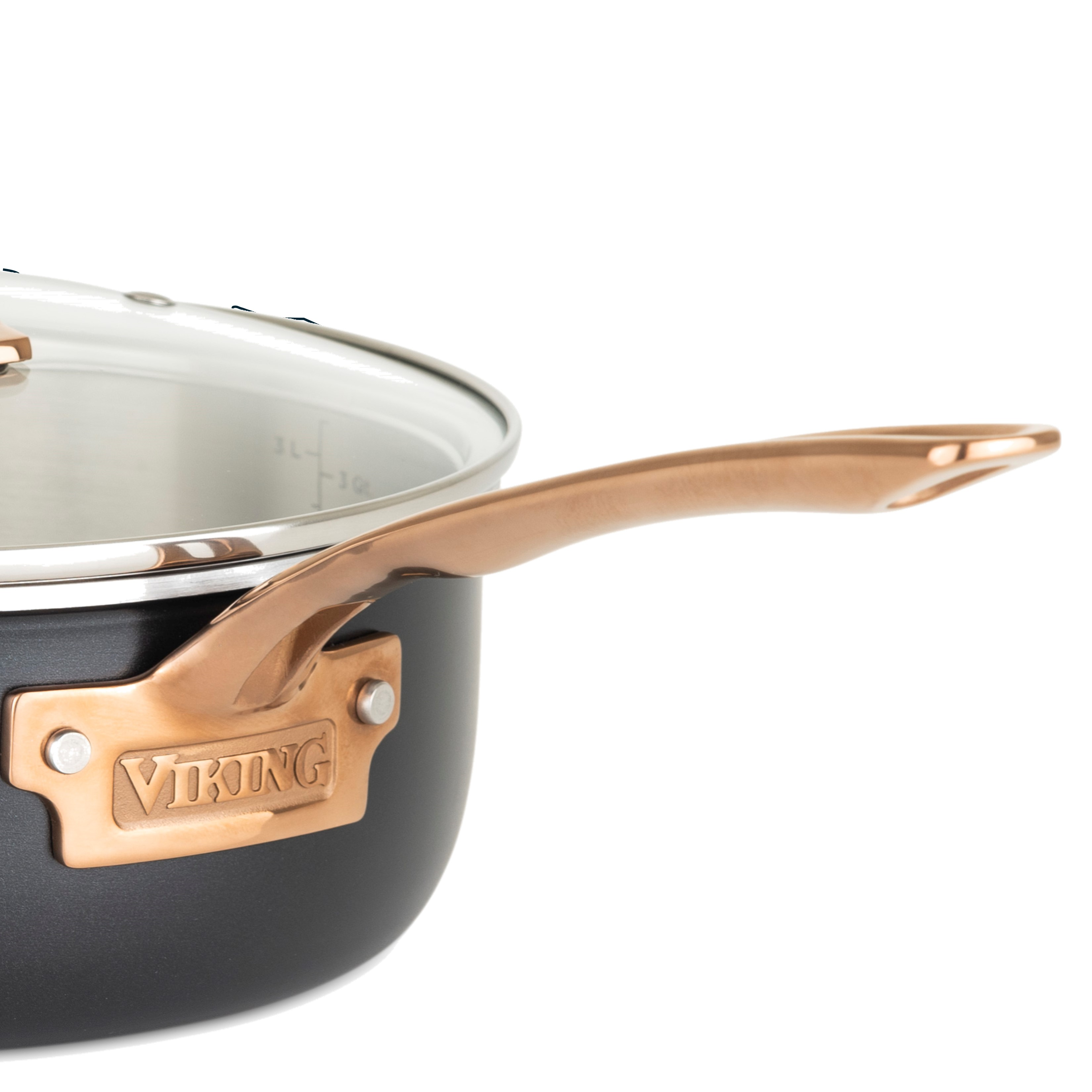 Close-up of the Viking Culinary Products 3-Ply Black and Copper 5 Quart Dutch Oven with glass lid, showing its shiny copper handle and accents. Measurement markings are visible inside. Induction compatible for versatile use.