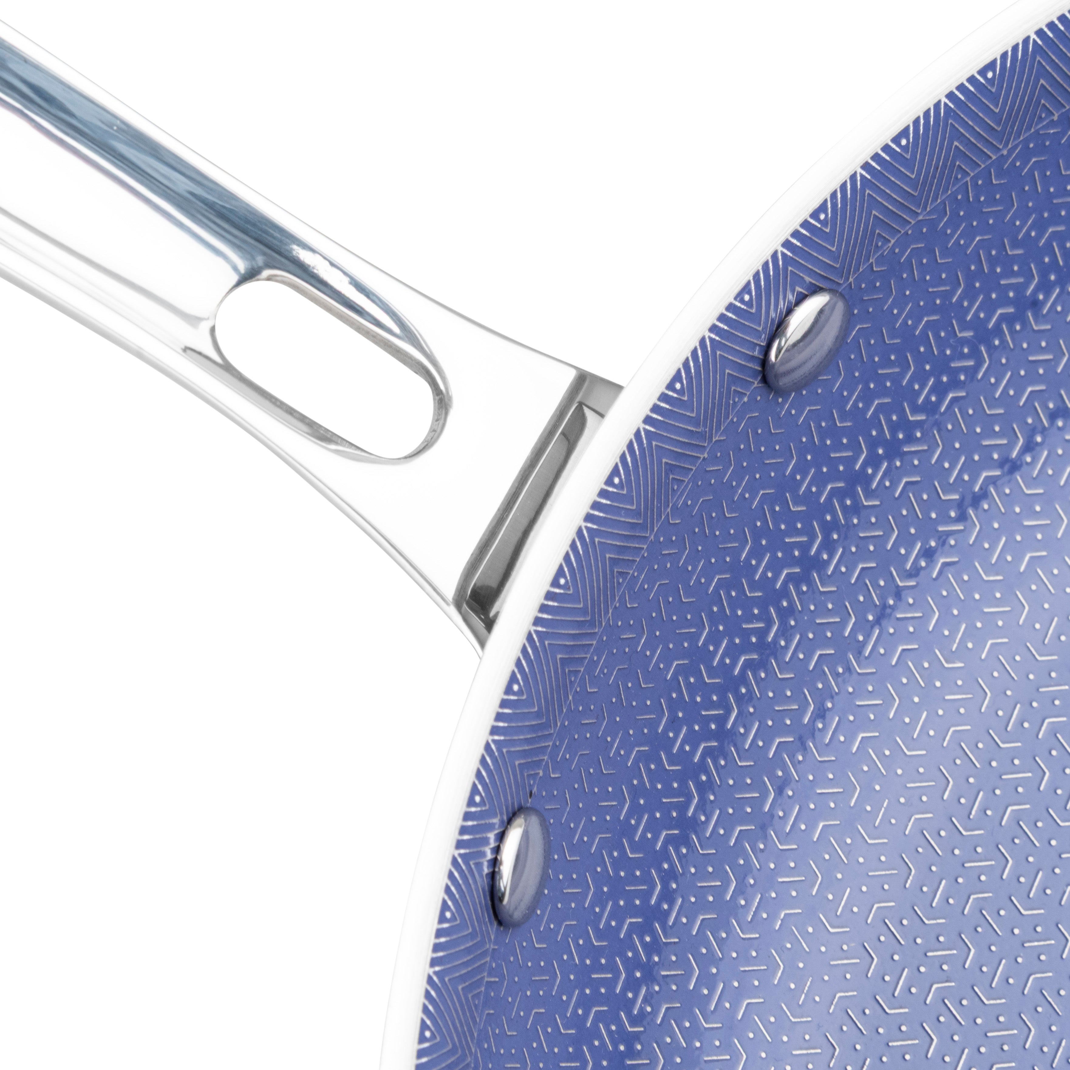 Close-up of Viking Culinary Products’ Viking 3-Ply Hybrid Plus Ceramic 2 Pc Nonstick Fry Pan Set (9.5" & 11"), featuring a shiny silver handle and blue geometric-patterned nonstick surface, highlighting its durable 3-ply construction.