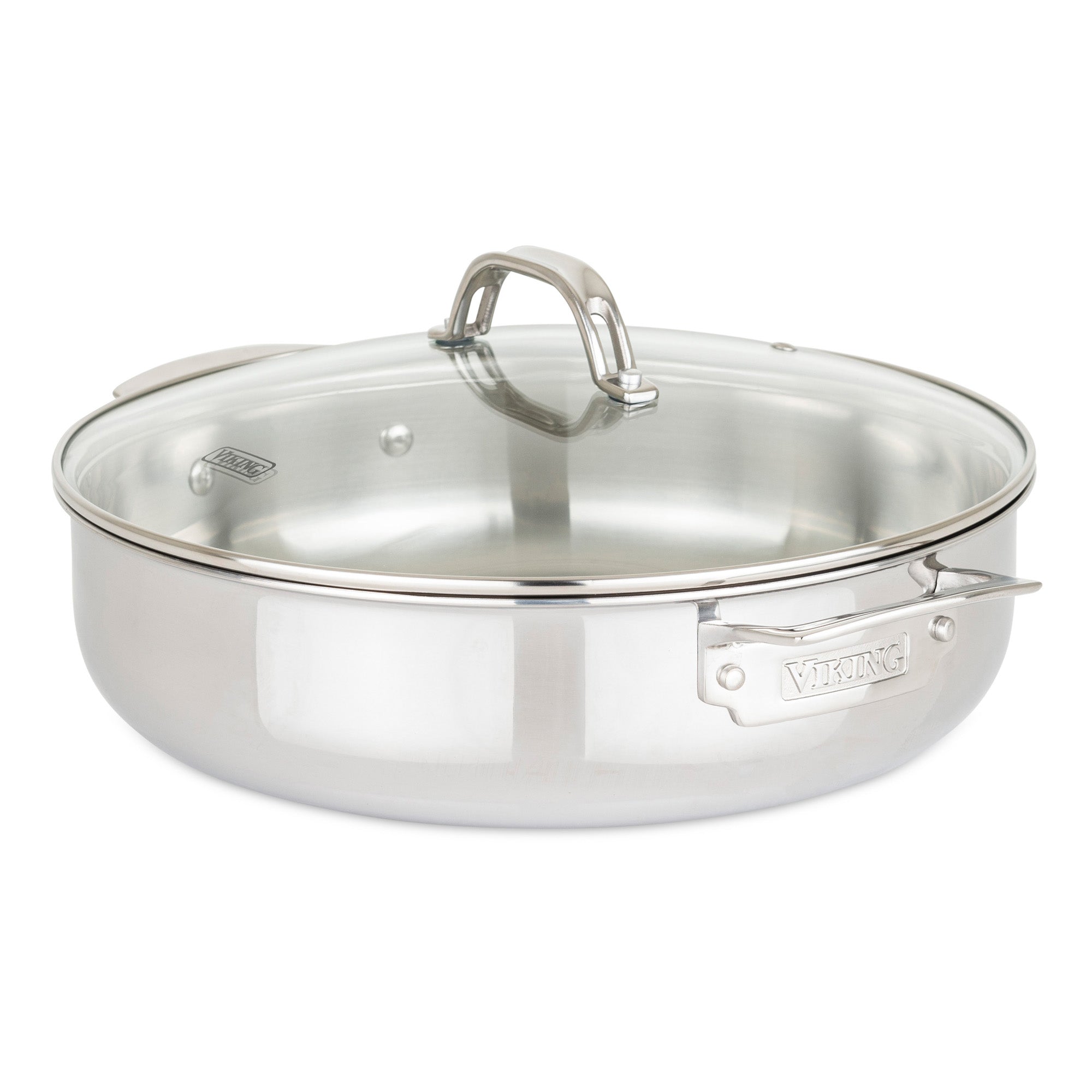 A Viking Culinary Products 3-Ply Stainless Steel sautÃ© pan from the 17-piece cookware set, shown on a white background, features stay-cool handles, a clear glass lid, and Viking engraved on the side handle. Oven safe.