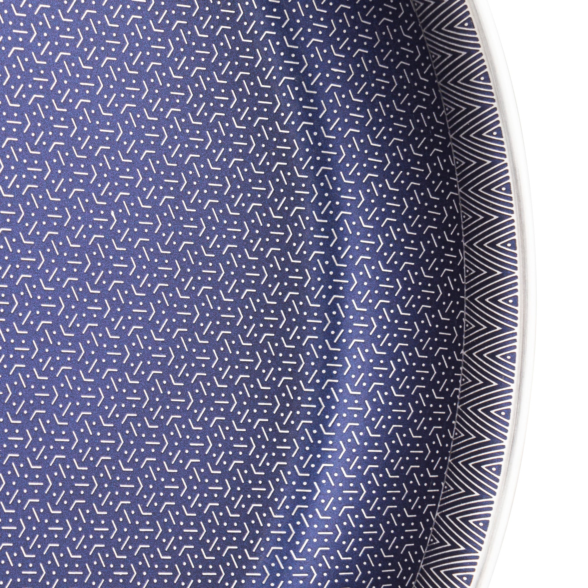 Close-up of a Viking 3-Ply Hybrid Plus 12-inch Nonstick Fry Pan by Viking Culinary Products, showing its sleek nonstick surface and part of the round pan with distinctive geometric detailing along the rim.