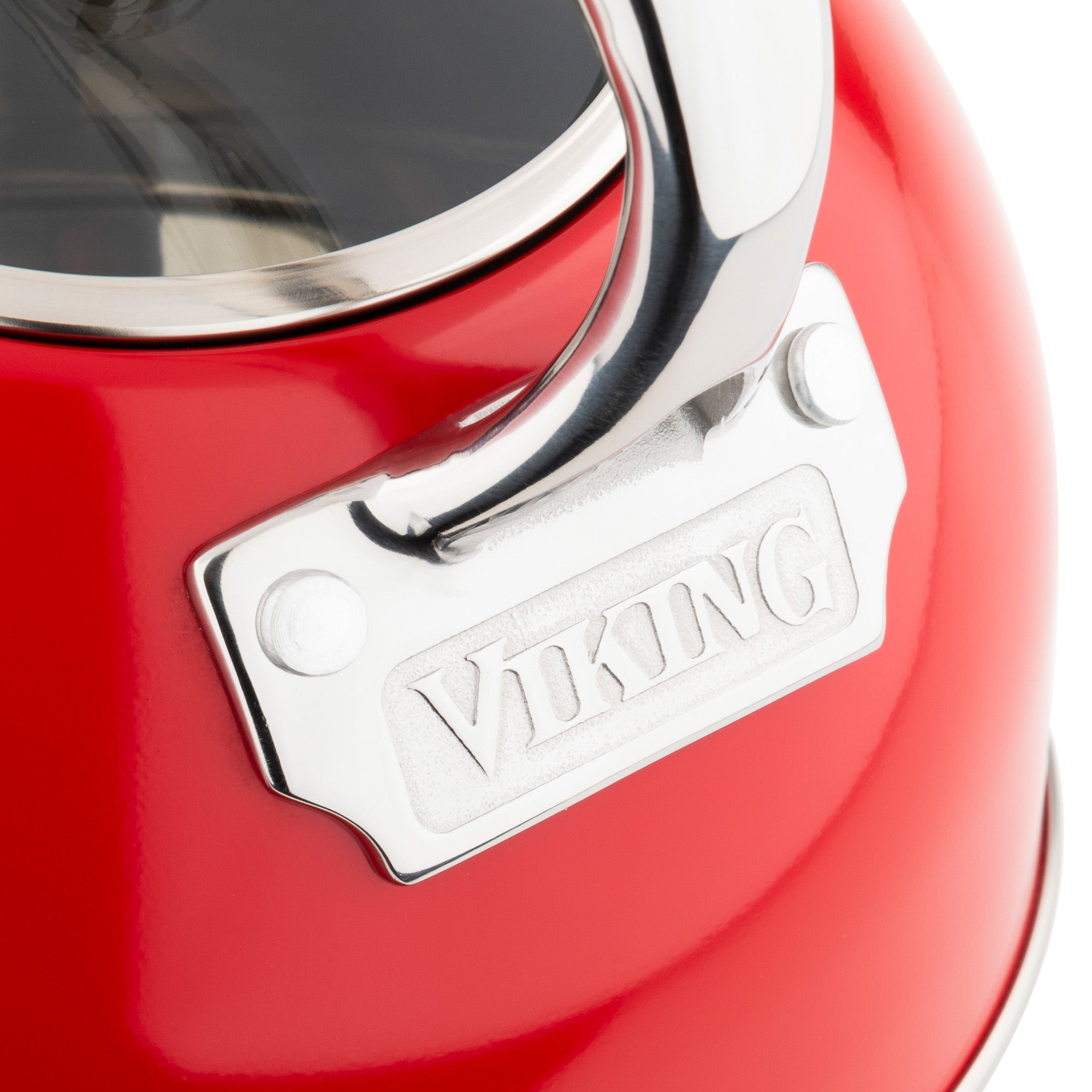 Close-up of the Viking 2.6-Quart Red Stainless Steel Whistling Kettle by Viking Culinary Products, featuring a silver handle, engraved metal plate, glossy finish, sturdy construction, and 3-ply base for induction stovetop compatibility.