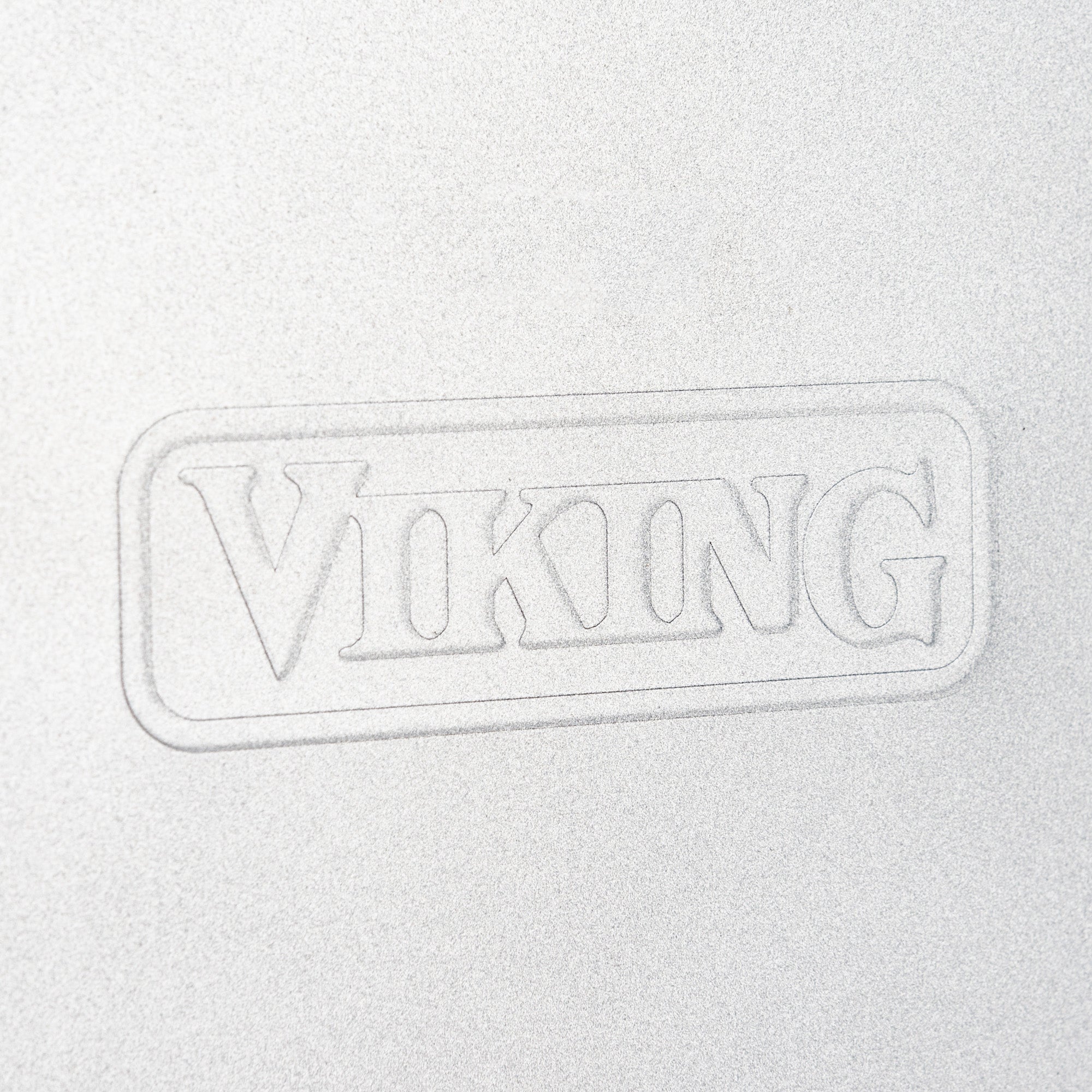 The Viking 15-Inch Aluminized Nonstick Baking Sheet by Viking Culinary Products features an embossed VIKING logo on a silver premium aluminized steel surface for durability.