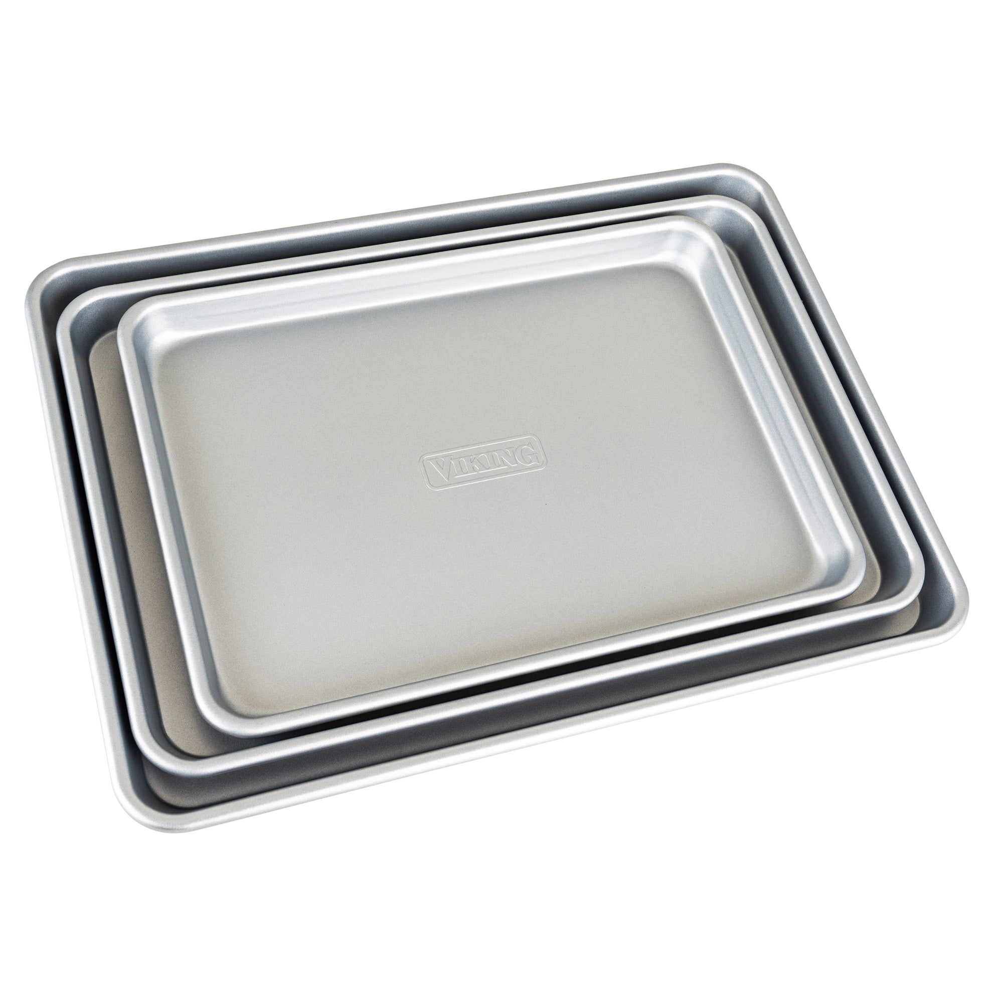 Three silver rectangular Viking Culinary Products nonstick aluminized steel baking sheets of different sizes nest together, seen from above. The top sheet displays the Viking brand embossed at its center.