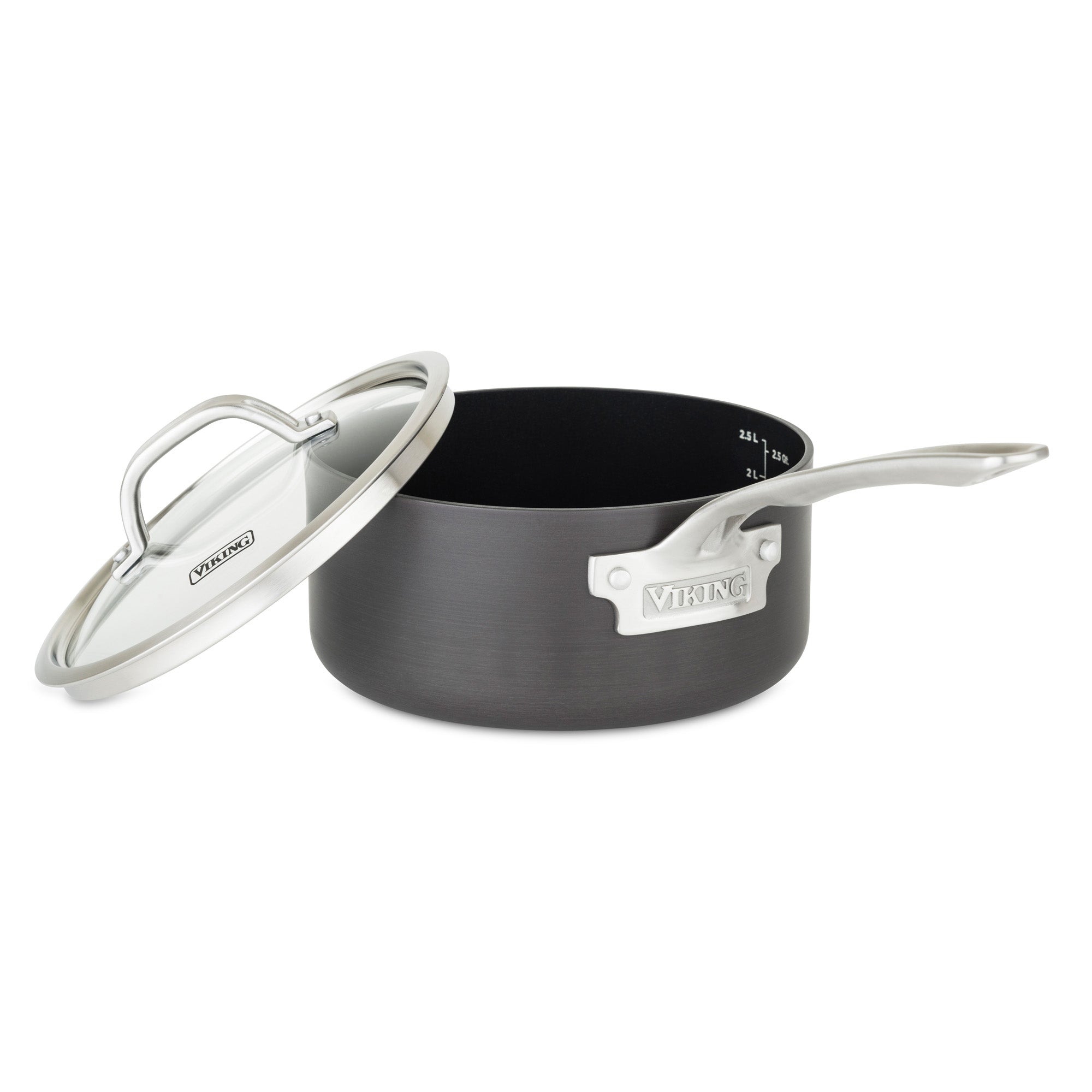 The Viking Hard Anodized Nonstick 3-Quart Sauce Pan with Glass Lid by Viking Culinary Products features a black finish, a silver handle, internal measurement markings, and comes with a matching glass lid leaning against the pot.