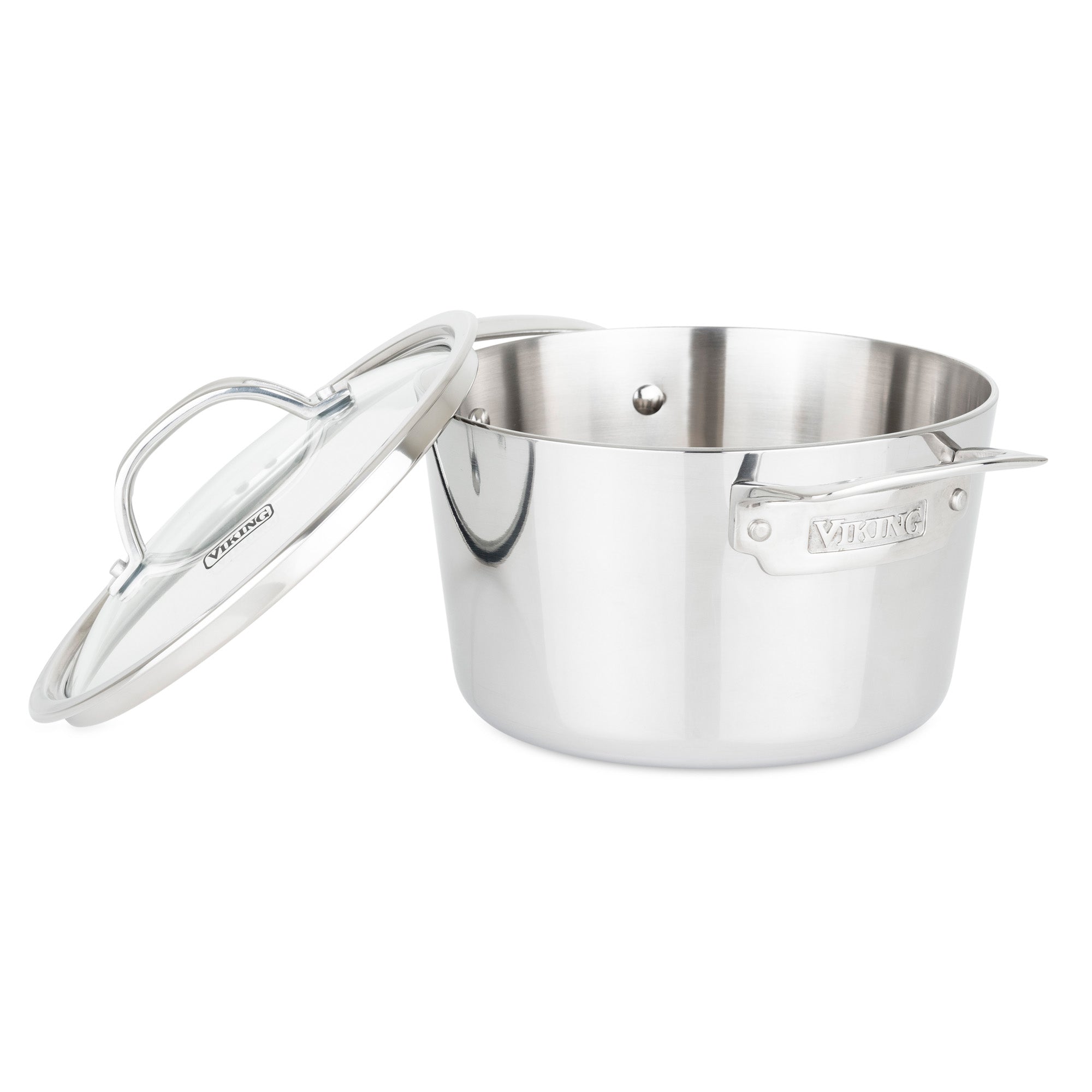 The Viking Contemporary 3-Ply Stainless Steel 3.4-Quart Soup Pot by Viking Culinary Products, featuring dual handles and an induction-compatible design, is shown with its glass lid resting angled beside it on a white background.