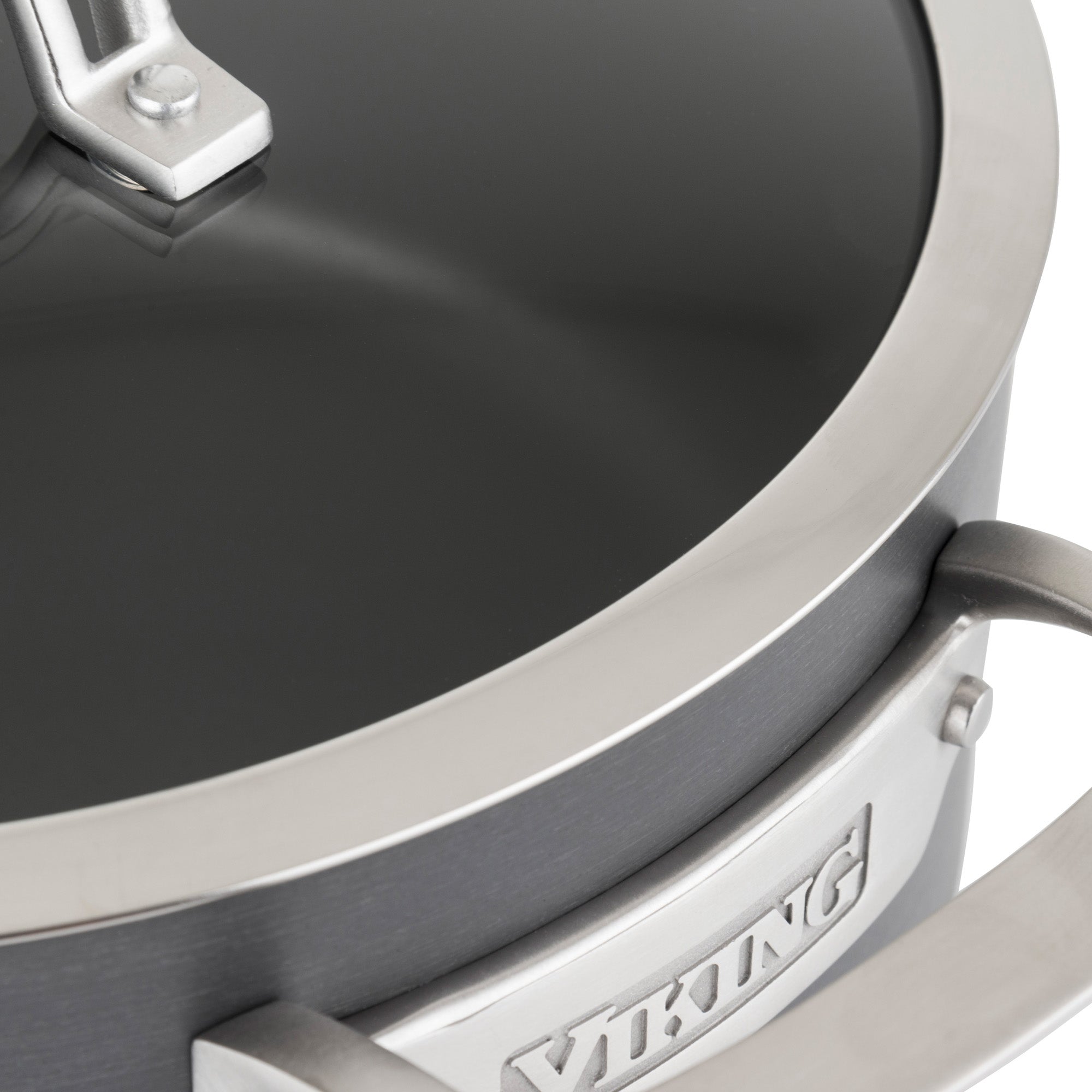 Close-up of a Viking Culinary Products Hard Anodized Nonstick 8-Quart Stock Pot with glass lid and sturdy, stay-cool handles. The Viking logo appears on a metal plate attached to the side of the pot.